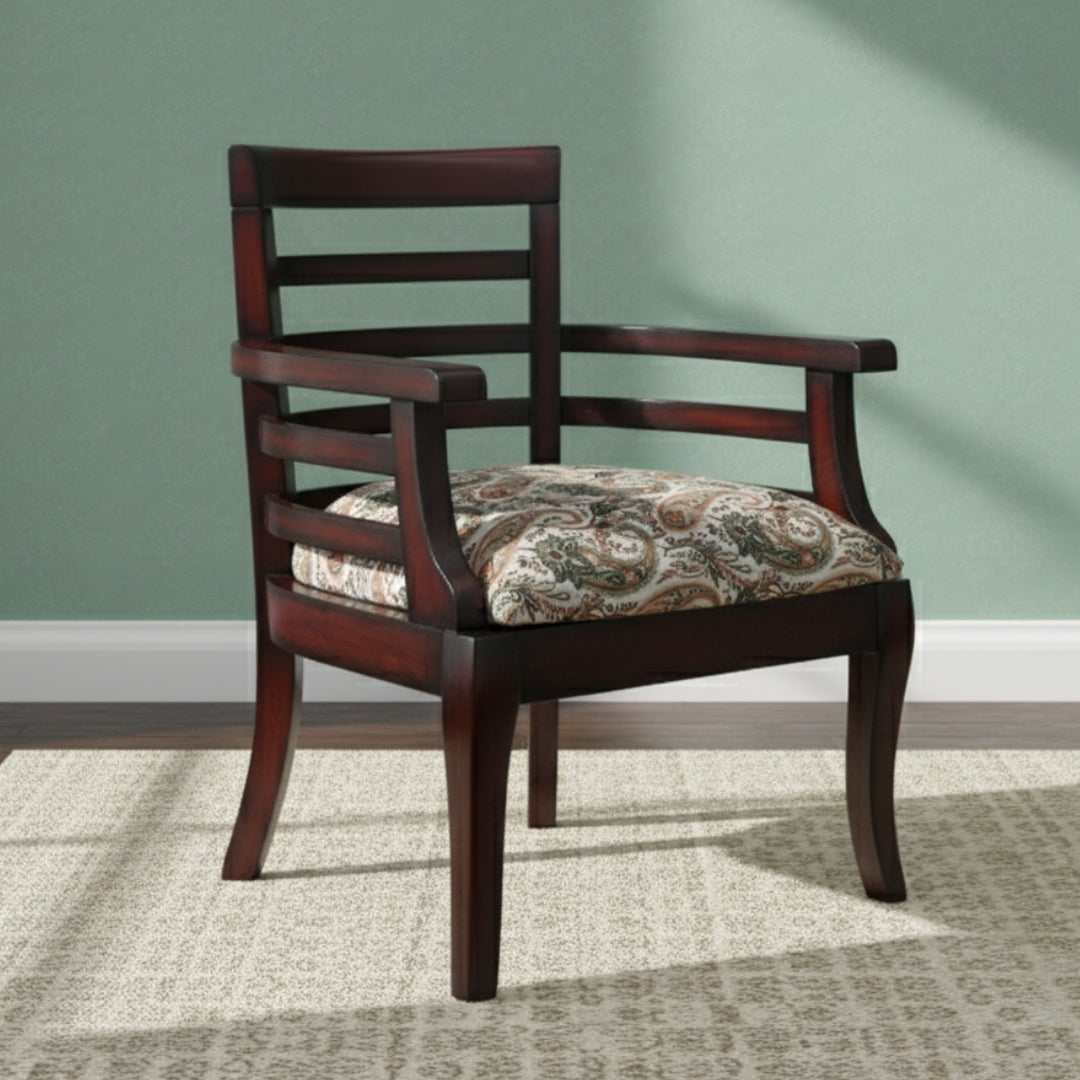 Wooden armchair with patterned cushion on a green wall and carpeted floor