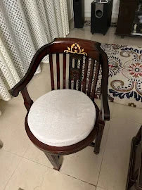 Customer photo: wooden chair with a round seat in their home