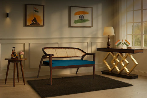A modern living room with a wooden bench, round side table, and geometric console table.