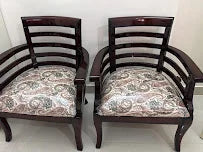 Customer photo: pair of wooden armchairs in their home