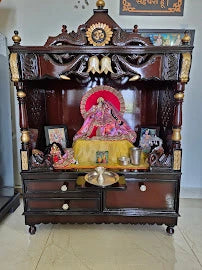Brown teak pooja mandir without doors in a customer's home
