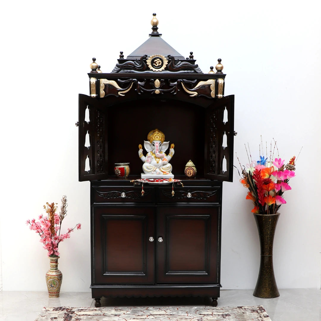 Big pooja mandir for home placed in a pooja room.