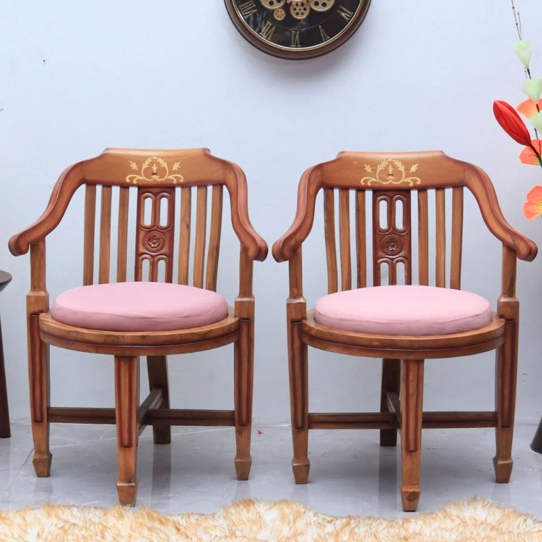 Lifestyle Image of Canasto Teak Wood Arm Chairs (Teak Pink)